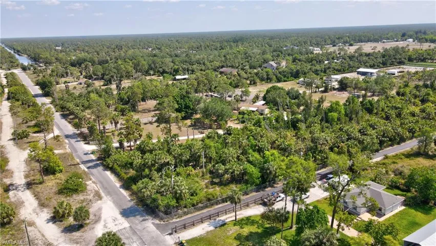 Aerial view featuring a view of trees