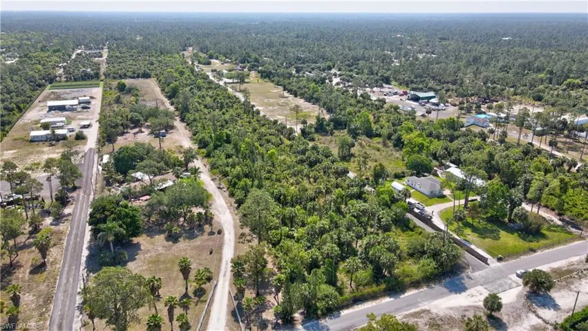 Aerial view featuring a view of trees