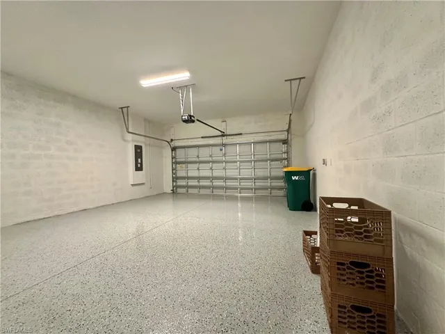 Garage with concrete block wall and electric panel