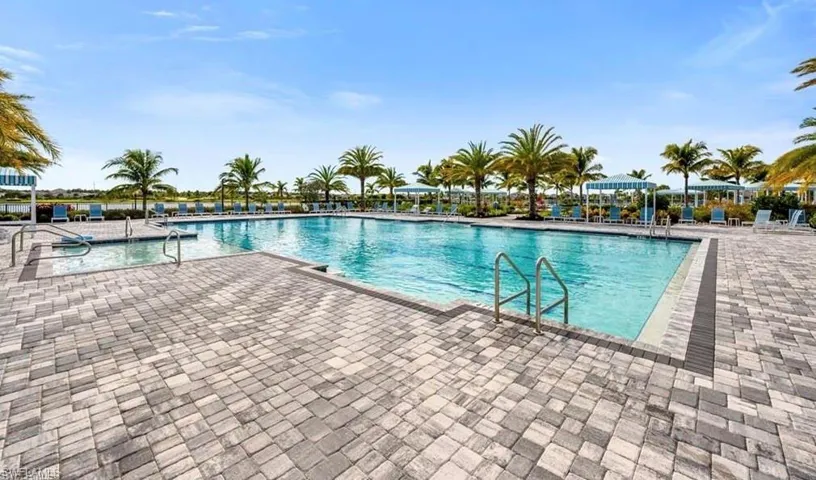Community pool featuring a patio