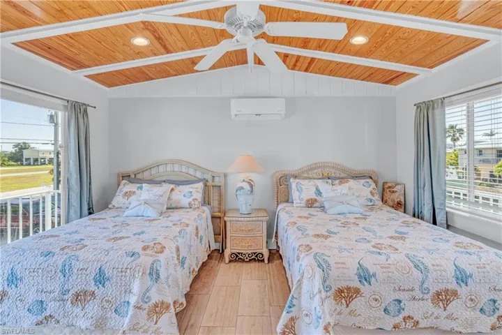 Bedroom featuring multiple windows, ceiling fan, recessed lighting, wood ceiling, and light wood finished floors