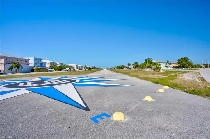 View of asphalt road with a residential view