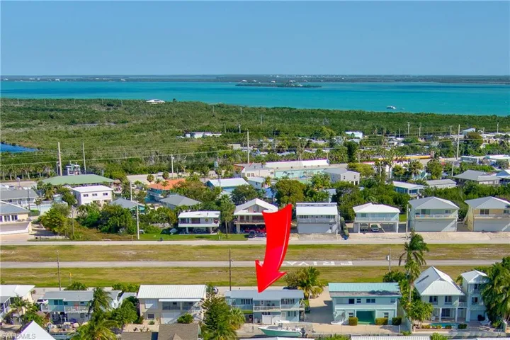 Aerial view of residential area with a nearby body of water