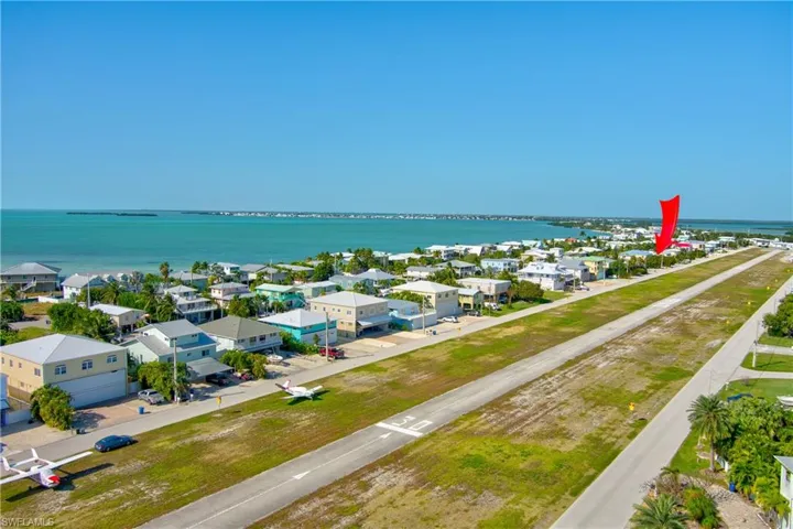 Aerial view of residential area with a nearby body of water