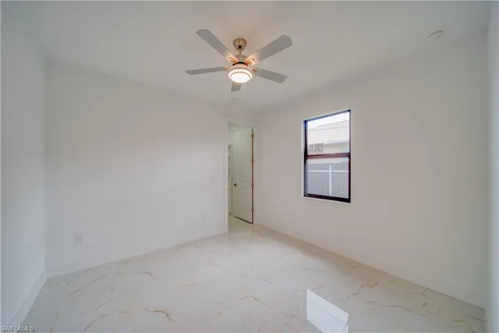 Spare room featuring ceiling fan