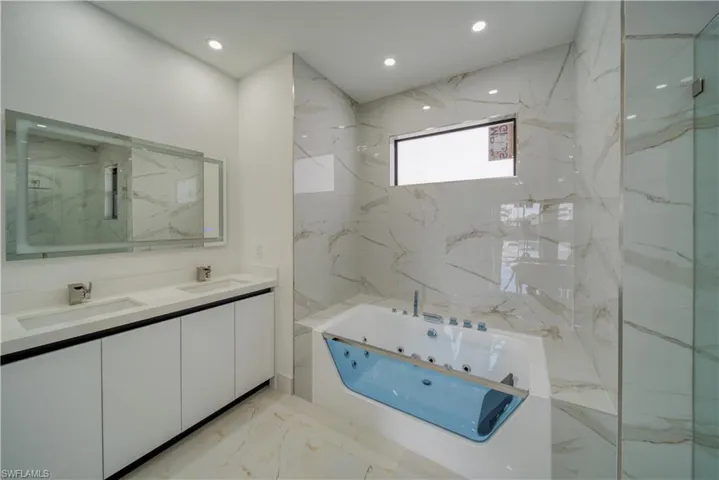 Bathroom featuring vanity and a bathtub