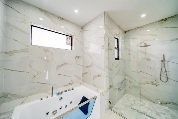 Bathroom featuring independent shower and bath