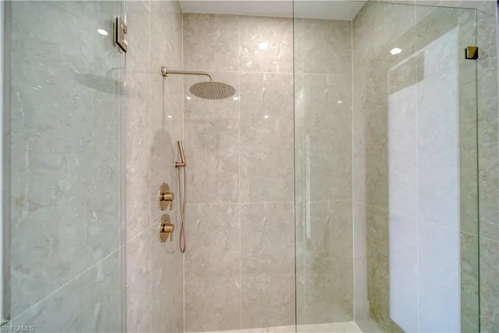 Bathroom with a shower with door