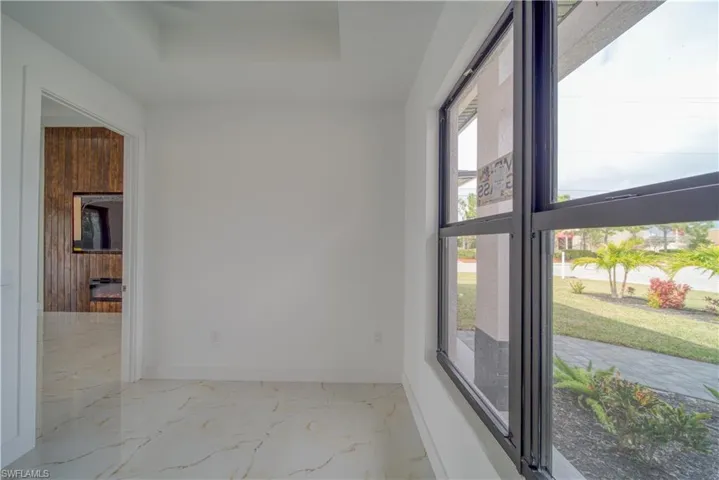 Spare room featuring a raised ceiling