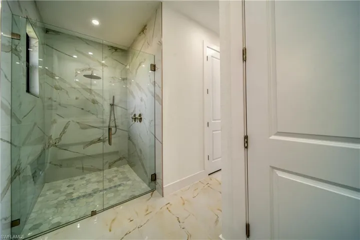 Bathroom featuring a shower with shower door