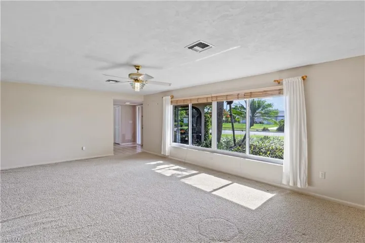 Front living area with beautiful windows and views of the front garden!