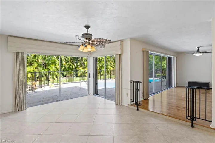 Spare room with ceiling fan and light wood-type flooring