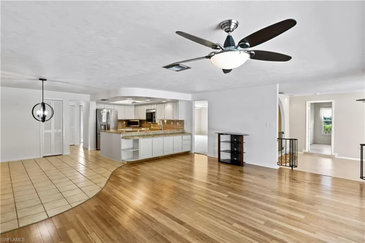 Another view of the living room off the kitchen and towards the outdoor pool area!