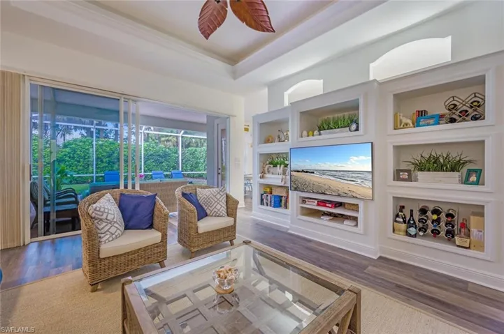 Living room featuring beautiful built in Book shelves.