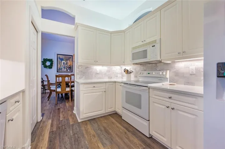Kitchen with pantry, plenty of cabinet storage and easy access to the dining room