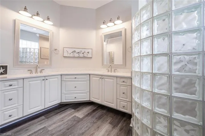 Master Bathroom with dual sinks and custom mirrors