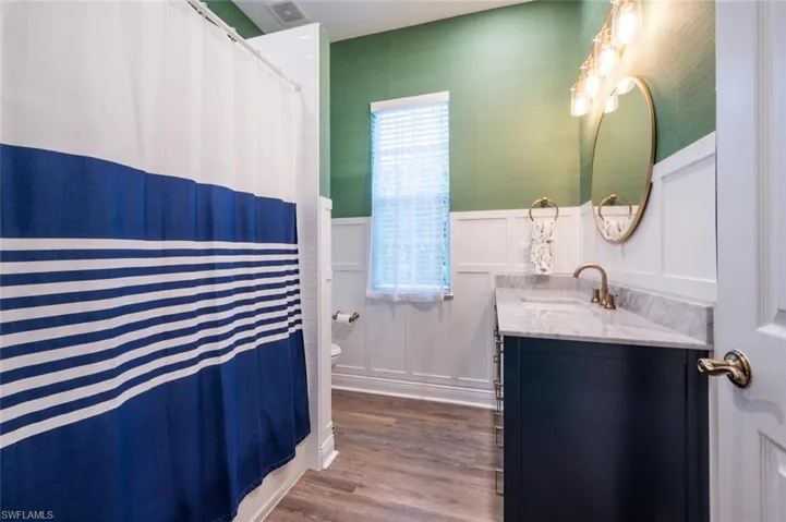 Guest Bath with custom wood working , new vanity and custom mirror