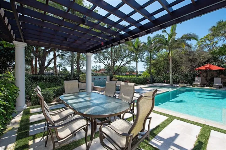 View of swimming pool with a patio,  pergola, and outdoor dining space