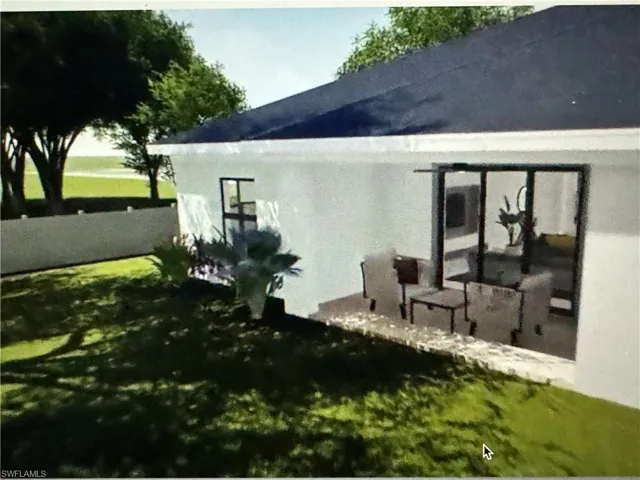 Prairie-style house with an attached garage, driveway, stucco siding, and a front lawn