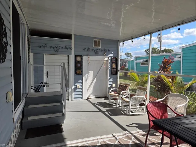 Breezeway with 2 sheds for storage.