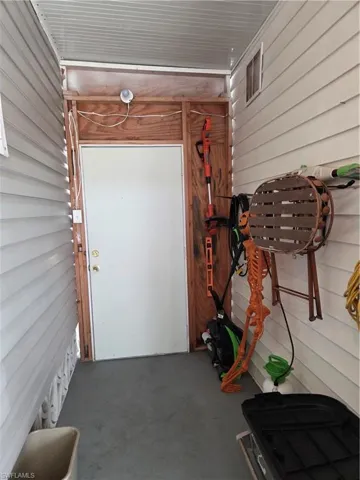 Large breezeway with access to the deck, patio & hot tub.