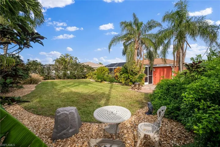 View of yard with a lanai