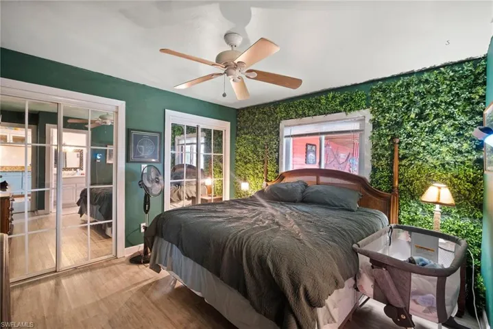 Bedroom with light hardwood / wood-style flooring and ceiling fan