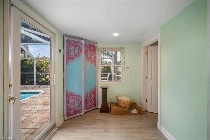 Doorway to outside with light hardwood / wood-style flooring