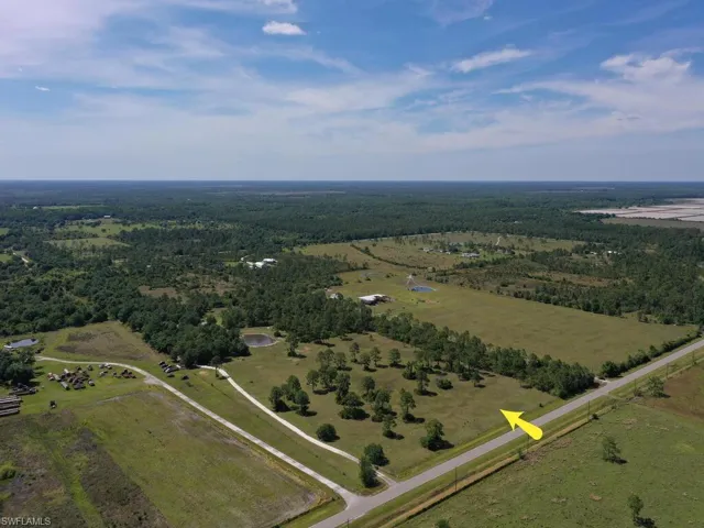 Long Drive Leading To Single Family Home