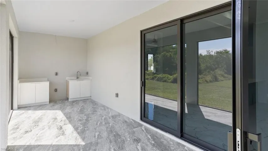 Laundry room featuring marble finish floor