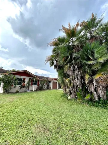 View of yard with a garage