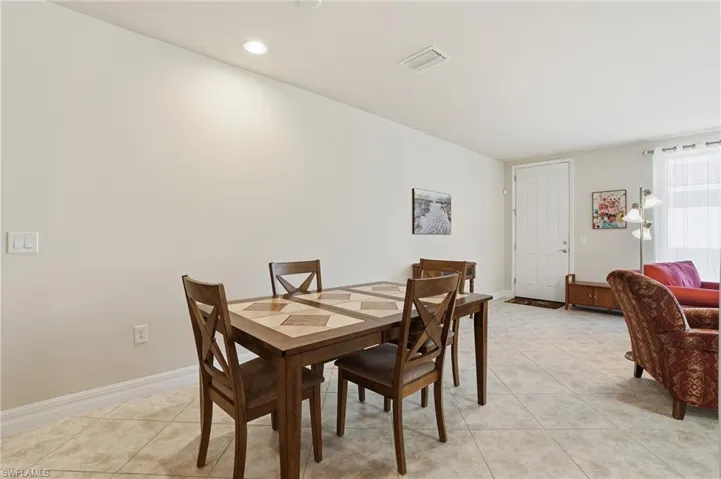 Dining area featuring light tile patterned floors