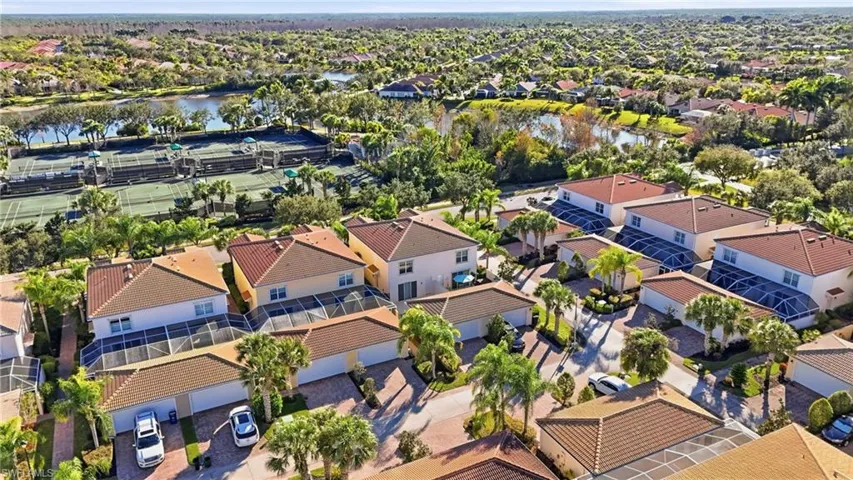 Aerial perspective of suburban area with a nearby body of water