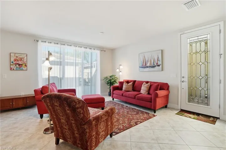 Living area with light tile patterned floors