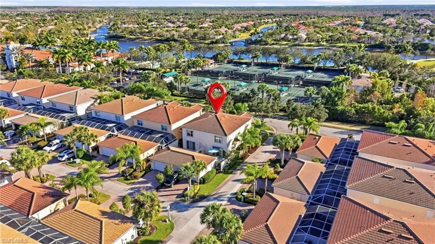 Aerial view of property's location featuring nearby suburban area and a large body of water