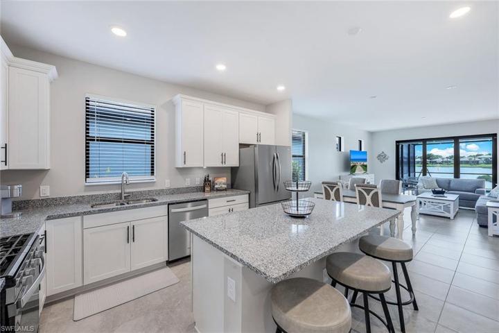 Granite counters, gas range, SS sink, 42" cabinets with pull-out shelves and soft close doors!!