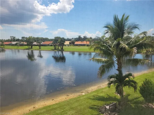 View of lake with bench to watch the water