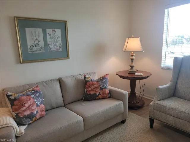 Large den away from bedrooms with large window makes a great spot for home office