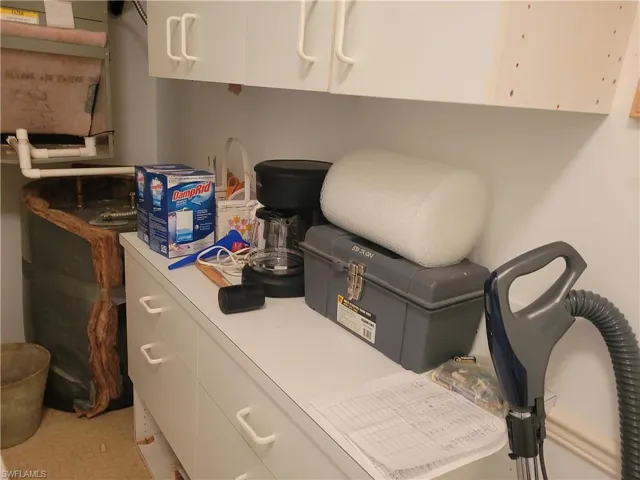 Spacious laundry room with extra cabinets
