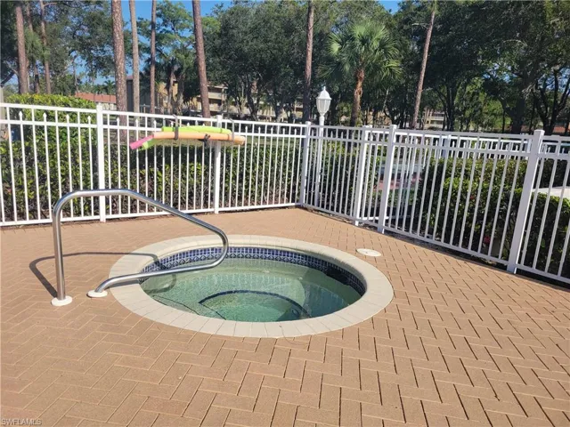 Spa conveniently located by pool