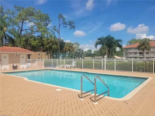 Heated pool with expanded paver brick deck.