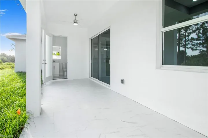 View of patio featuring ceiling fan