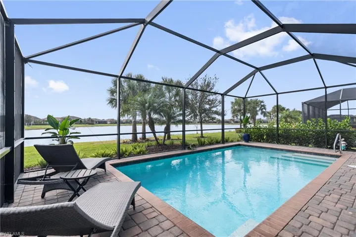 Enjoy evening swims in your own large pool overlooking a calm, serene lake.