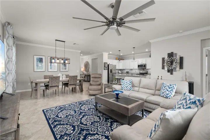 The great room is open to kitchen and formal dining area.