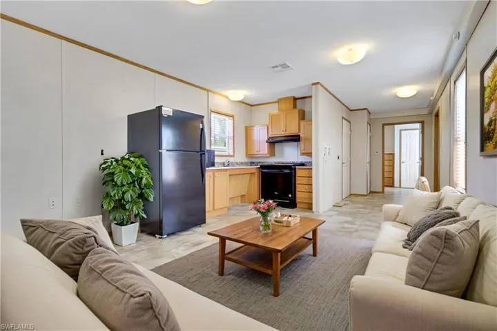 Living area featuring ornamental molding