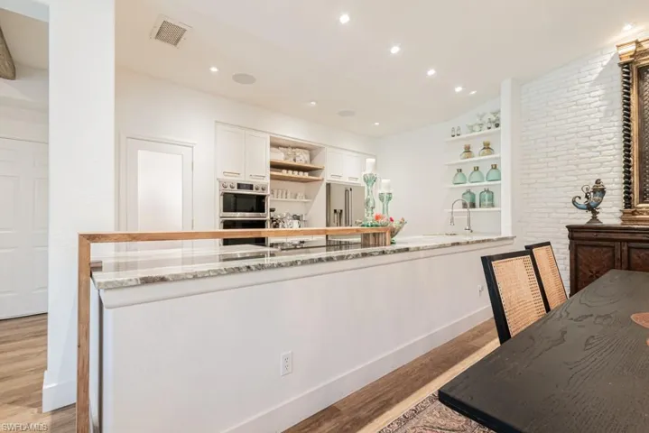 Exceptional kitchen with every imaginable upgrade. Quartz countertop with mahogany wood shelf trim.  Lots of storage space and walk in pantry.