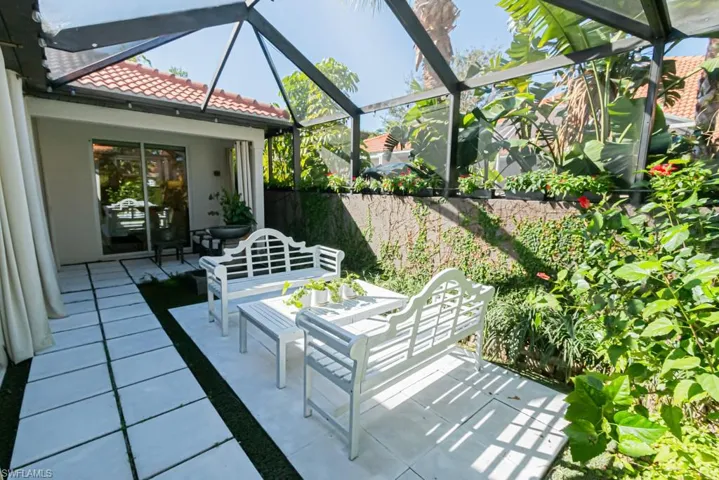 Private patio with fountain and landscaping