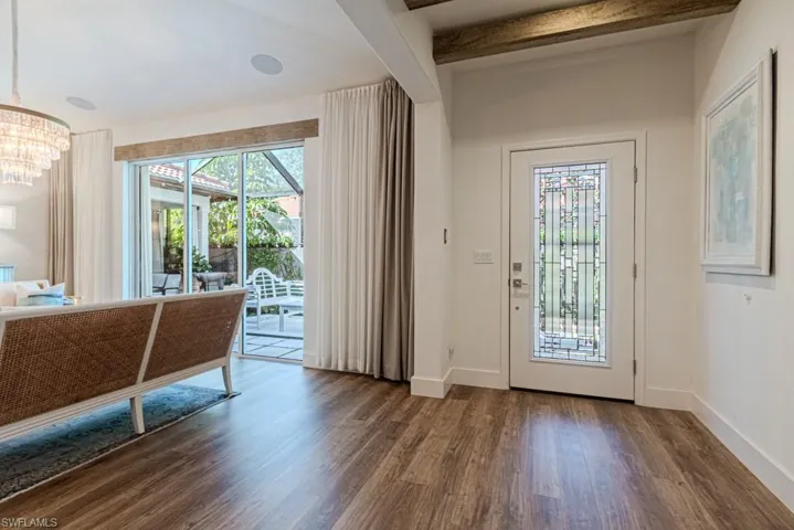Spacious entry with view to side garden room