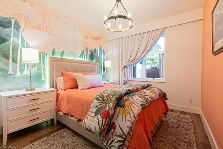 Guest Bedroom with Custom Mural handpainted by the owner ..Cozy fabrics, rugs and furniture finish the tranqulity of this cheerful and inviting room.
