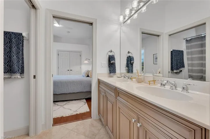 Bathroom featuring tile patterned flooring and vanity
